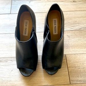 Black leather heeled zip up booties with peep toe. Steve Madden
